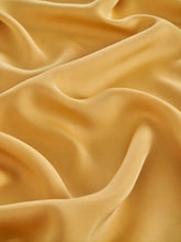 Orange cloth is made from viscose fabric.